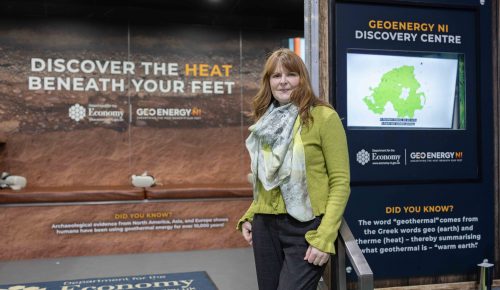 Minister stands on the steps of GeoEnergy Discovery Centre
